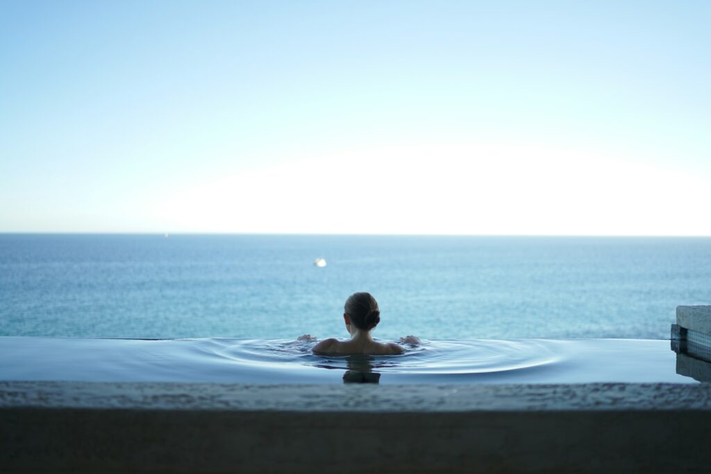 A woman at an infinity pool.
