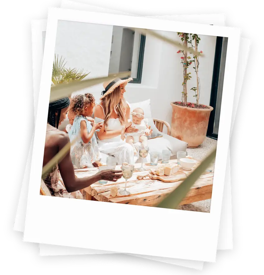 A polaroid-style image of a mom and kids in a vacation home from OneFineStay, one of the suggested AirBnB alternatives.